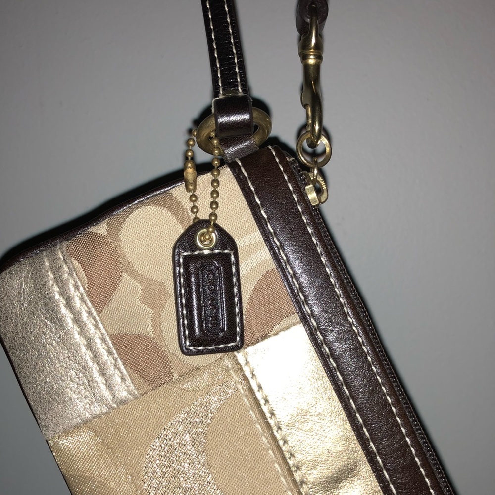 Gold Coach wristlet.
